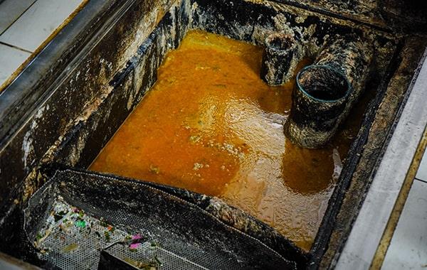 proper grease trap cleaning helps prevent grease and oil from entering the drain system and polluting waterways